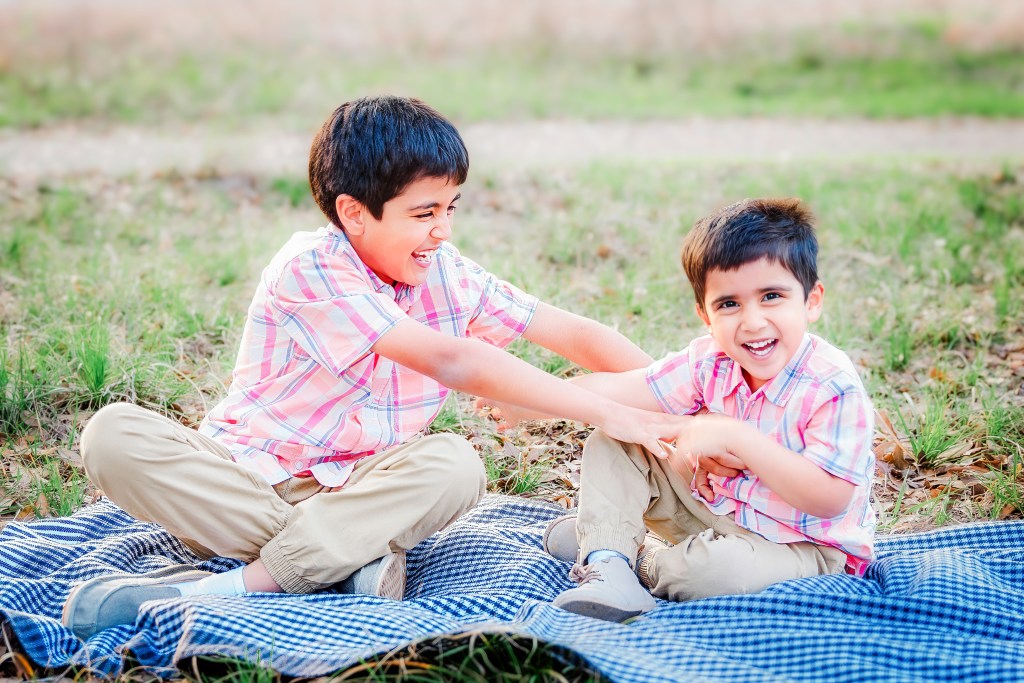 Outdoor family photoshoot capturing joyful moments with Furqan Saleemi